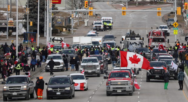 Truckers and supporters block access to the Ambassador Bridge, which connects Detroit and Windsor, in protest against coronavirus disease (COVID-19) vaccine mandates, in Windsor, Ontario, Canada February 12, 2022. REUTERS/Carlos Osorio/File Photo