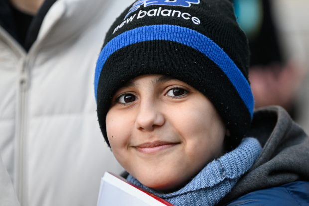 Hassan Alkhalaf, 11, who has escaped Ukraine on his own to join his brother studying in Slovakia, attends an anti-war rally, following Russia's invasion of Ukraine, in Bratislava, Slovakia, March 11, 2022. REUTERS/Radovan Stoklas