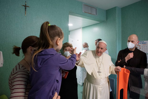 Pope Francis visits Bambino Gesu Pediatric Hospital to thank for caring for Ukrainian children, who fled the Russian invasion of Ukraine, in Rome, Italy, March 19, 2022. Since the beginning of the conflict, the hospital has taken care of about 50 Ukrainian children. Vatican Media/Handout via REUTERS