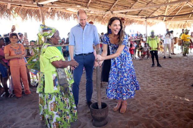 Britain's Prince William and Catherine, Duchess of Cambridge, laugh as they spend time with the locals during their visit to Hopkins, a small village on the coast which is considered to be cultural centre of the Garifuna community in Belize, amid a tour of the Caribbean, March 20, 2022. Chris Jackson/Pool via REUTERS