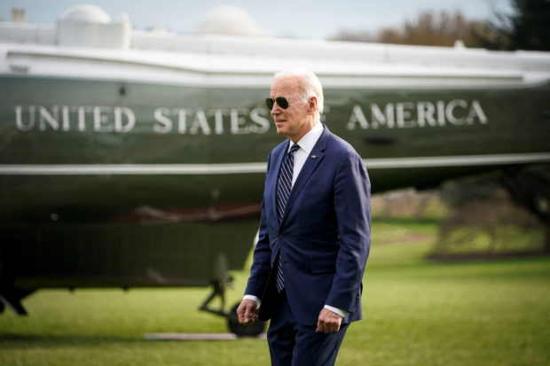 FILE PHOTO: U.S. President Joe Biden walks to board Marine One, before traveling to Rehoboth Beach, Delaware for the weekend, on the South Lawn of the White House in Washington, U.S., March 18, 2022. REUTERS/Al Drago/File Photo