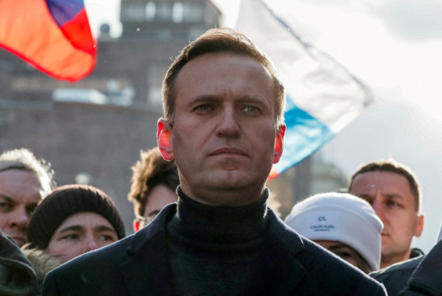 FILE PHOTO: Kremlin critic Alexei Navalny takes part in a rally to mark the 5th anniversary of opposition politician Boris Nemtsov's murder and to protest against proposed amendments to the country's constitution, in Moscow, Russia February 29, 2020. REUTERS/Shamil Zhumatov/File Photo