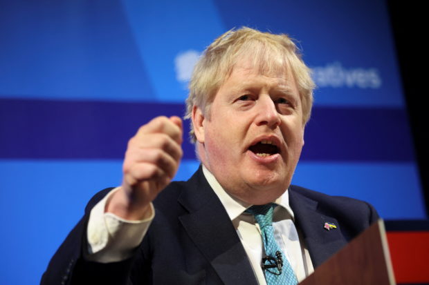 FILE PHOTO: British Prime Minister Boris Johnson speaks at the Conservative Party Spring Conference in Blackpool, Britain March 19, 2022. REUTERS/Phil Noble