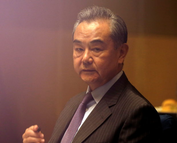 FILE PHOTO: China's Foreign Minister Wang Yi listens during a meeting in Manila, Philippines January 16, 2021. Francis Malasig/Pool via REUTERS/File Photo
