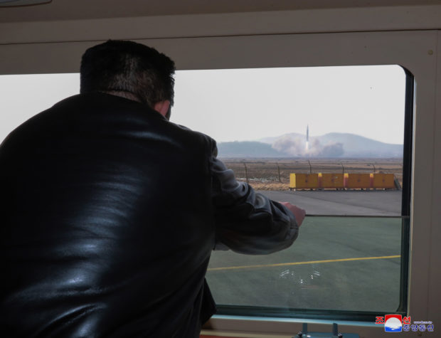 North Korean leader Kim Jong-un watches a Hwasong-17 intercontinental ballistic missile (ICBM) 