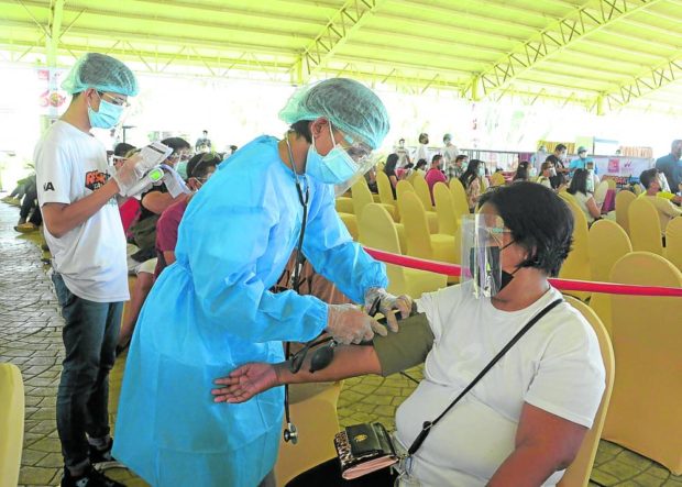 Tourism workers in Davao City receive their COVID-19 vaccine shots