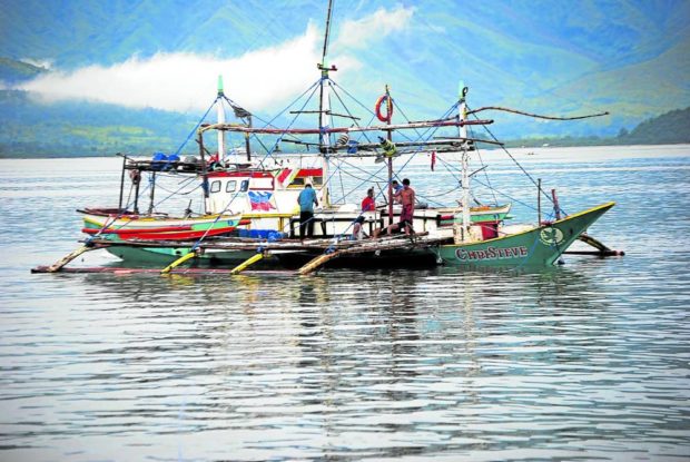 Fishermen from Subic, Zambales prepare their boats for another fishing trip
