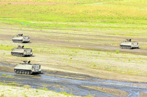 Armored military vehicles in Capas, Tarlac. STORY: No Aetas displaced as PH, US roll out war exercises in Tarlac, mayor assures