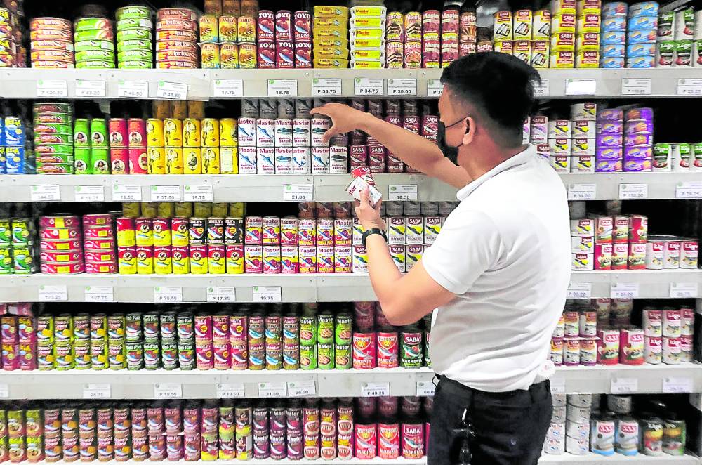 Sardine cans on a store shelf