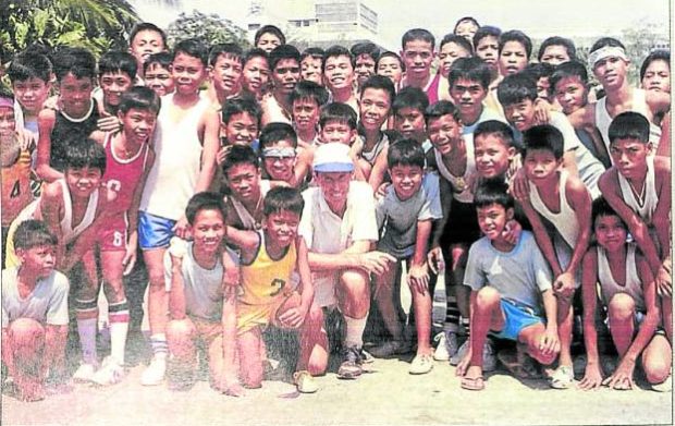 ONE OF THE BOYS Father Al after jogging with a group of boys at Rizal Park, at a time before he was diagnosed with ALS (amyotrophic lateral sclerosis).