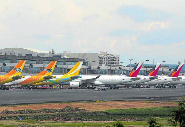 Planes at NAIA. STORY: Telco, airlines now open to full foreign ownership