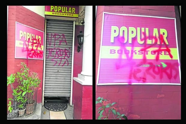 Vandlalized facade of Popular Bookstore. STORY: Red-tagging vandals target Popular Bookstore