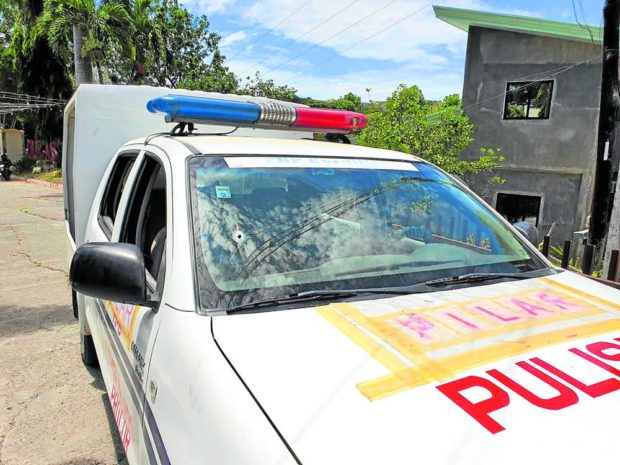 HIT A bullet pierces through the windshield of a police patrol car in Pilar, Abra, after policemen engage security aides of Vice Mayor Jaja Josefina Somera Disono in a shootout on Tuesday. —PHOTO COURTESY OF PNP CORDILLERA