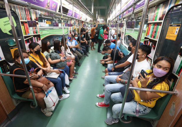 Inside LRT 1 train, for story: Old transport problems test ‘new normal’ shift