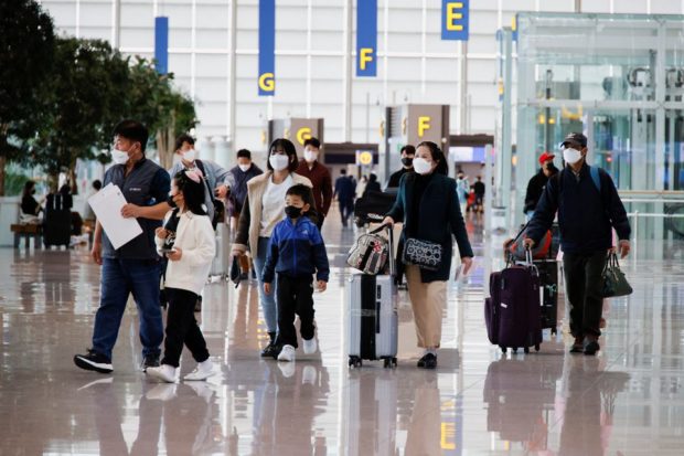 People wearing face masks to prevent contracting from the coronavirus disease (COVID-19)
