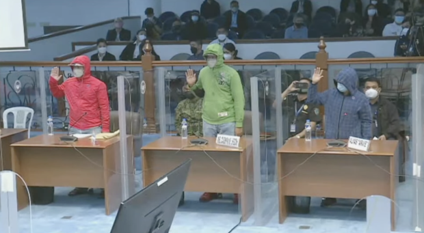 Three witnesses who came forward and linked 8 suspects to the disappearance of six cockfight enthusiasts who went missing last January 2022 take their oath before testifying at the Senate public order committee hearing on Mar. 21, 2022. Screengrab from Senate livestream