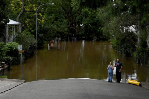 Thousands of Australians return to ‘uninhabitable’ homes as floods recede