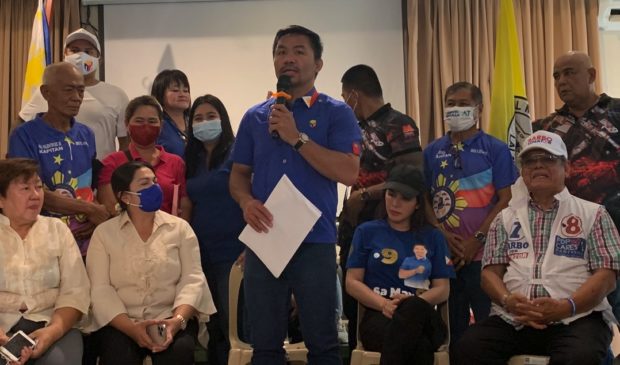 Presidential candidate Manny Pacquiao talks to local officials in Cavite province on Monday, March 21, 2022. INQUIRER.net/Daphne Galvez