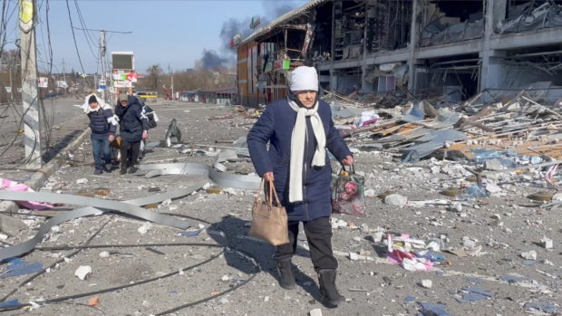 FILE PHOTO: People flee the Russia's invasion of Ukraine, in Bucha, Ukraine March 12, 2022 in this screen grab taken from a handout video. Video taken March 12, 2022. ICRC/Handout via REUTERS