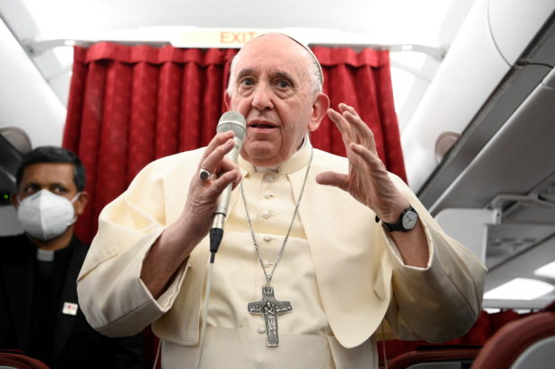 Pope Francis holds a news conference aboard the papal plane on his flight back after visiting Malta, April 3, 2022. Vatican Media/­Handout via REUTERS