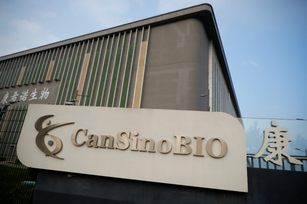 FILE PHOTO: A logo of China's vaccine specialist CanSino Biologics Inc is pictured on the company's headquarters in Tianjin, following an outbreak of the coronavirus disease (COVID-19), China August 17, 2020. REUTERS/Thomas Peter/File Photo