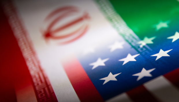 FILE PHOTO: Iran's and U.S.' flags are seen printed on paper in this illustration taken January 27, 2022. REUTERS/Dado Ruvic/Illustration
