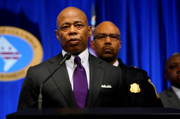 FILE PHOTO: New York City Mayor Eric Adams speaks during a news conference about recent shootings of homeless people in both New York and Washington, at the John A. Wilson Building in Washington, U.S., March 14, 2022. REUTERS/Elizabeth Frantz/File Photo