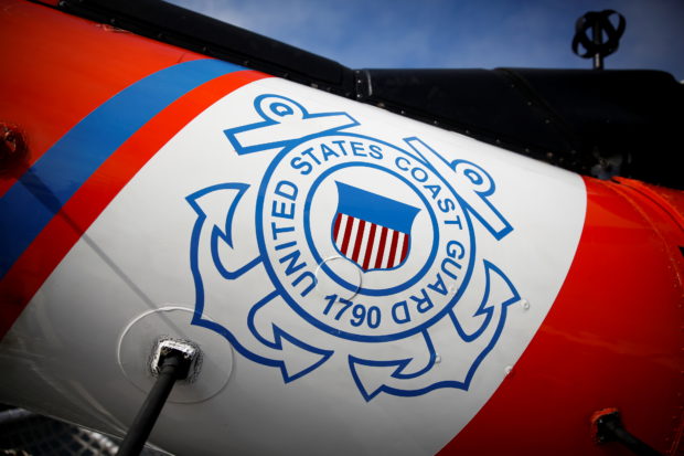FILE PHOTO: The U.S. Coast Guard's logo is seen on an helicopter on the deck of the Coast Guard Cutter Hamilton at Port Everglades, in Fort Lauderdale, Florida, U.S. November 22, 2021. REUTERS/Marco Bello