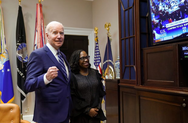 U.S. President Joe Biden and Supreme Court nominee Judge Ketanji Brown Jackson watch as the full U.S. Senate votes to confirm Jackson as the first Black woman to serve on the U.S. Supreme Court, from the Roosevelt Room at the White House in Washington, U.S., April 7, 2022. REUTERS/Kevin Lamarque