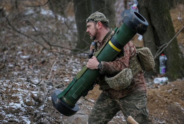 Ukrainian service member holds a Javelin missile system at a position on the front line in the north Kyiv region. STORY: US will supply Ukraine with ‘weapons it needs’ vs Russia