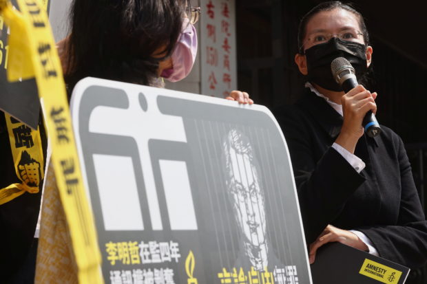 China releases jailed Taiwanese activist, sends him home