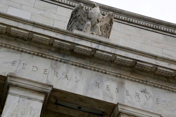 FILE PHOTO: An eagle tops the U.S. Federal Reserve building's facade in Washington, July 31, 2013. REUTERS/Jonathan Ernst/