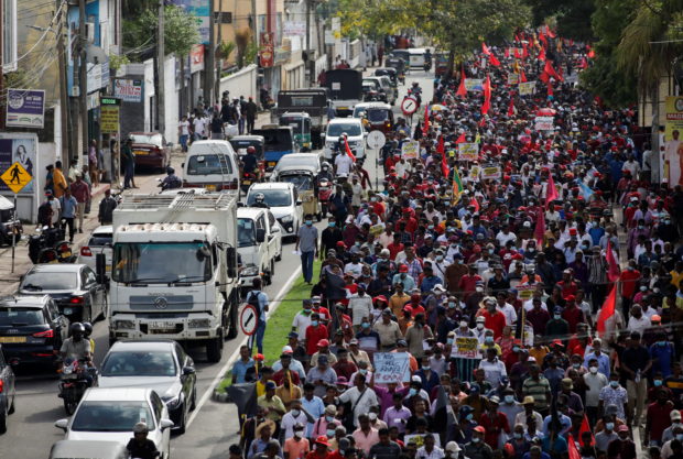 Members and supporters of Sri Lanka's opposition the National People's Power Party march towards Colombo from Beruwala, during a protest against Sri Lankan President Gotabaya Rajapaksa, amid the country's economic crisis, in Colombo, Sri Lanka April 19, 2022. REUTERS/Navesh Chitrakar