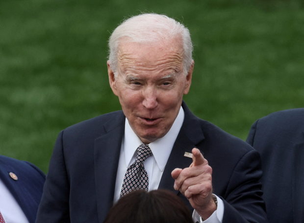 FILE PHOTO: U.S. President Joe Biden speaks to guests after delivering remarks on administration efforts to strengthen national supply chains and increase the number of truck drivers, at the White House in Washington, U.S., April 4, 2022. REUTERS/Leah Millis/File Photo