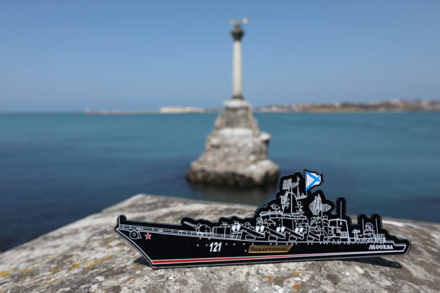 FILE PHOTO: A magnet depicting the Russian missile cruiser Moskva, which sank in the Black Sea following a fire, is pictured at an embankment in Sevastopol, Crimea April 15, 2022. REUTERS/Alexey Pavlishak/File Photo