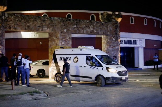 A forensic vehicle transporting the body of a woman found inside a water tank, leaves the Nueva Castilla Motel, near the place where Debanhi Escobar, an 18-year old student, has been missing since April 9, in Escobedo, Mexico April 22, 2022. REUTERS/Daniel Becerril