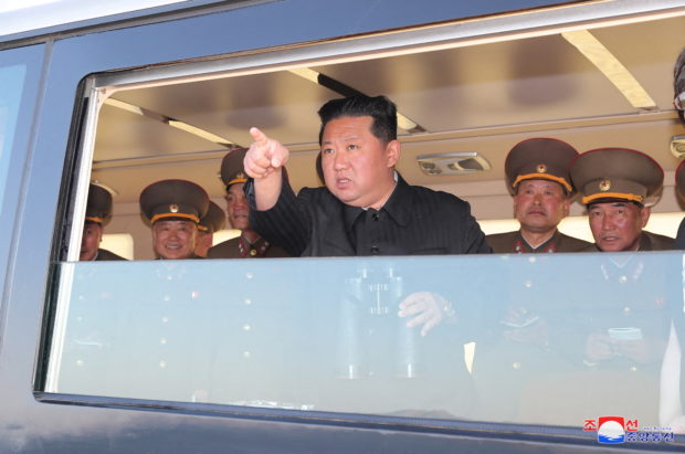 North Korean leader Kim Jong Un gestures as he watches the test-firing of a new-type tactical guided weapon according to state media, North Korea, in this undated photo released on April 16, 2022 by North Korea's Korean Central News Agency (KCNA). KCNA via REUTERS