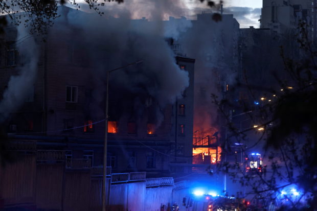 Fire burns in a building after a shelling, amid Russia's invasion of Ukraine, in Kyiv, Ukraine April 28, 2022. REUTERS/Zohra Bensemra