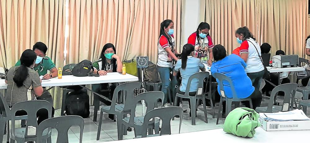 GET VAXXED FIRST Teachers in Cebu City wait to be vaccinated against COVID-19 in preparation for the resumption of in-person classes in this photo taken on March 30. NESTLE SEMILLA