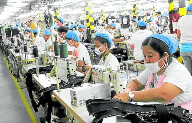 LOW PAY, HIGH PRICES Workers are demanding higher pay to be able to cope with the higher prices of basic commodities. —FILE PHOTO