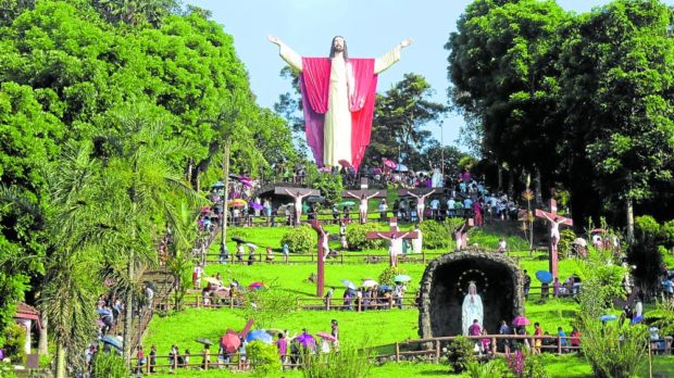 FAITH AND DEVOTION In this photo taken during Holy Week in 2019, devotees flock to Kamay ni Hesus shrine in Lucban, Quezon, to pray and reflect as they climb the “Stairway to Heaven” where the five-story-high statue of the resurrected Christ stands on top of the hill. The shrine has reopened this week as pandemic restrictions have been relaxed. —Delfin T. Mallari Jr.