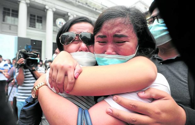 SUCCESS! Bar exam passers tear up as they celebrate at the Supreme Court grounds on Tuesday. A total of 8,241 (or 72.28 percent) out of 11,402 takers passed the 2020-21 examinations, the first to be held digitally due to the pandemic. —NIÑO JESUS ORBETA