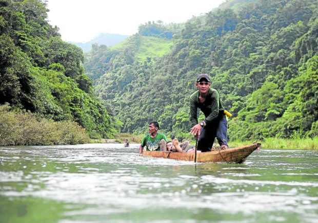 A group of Dumagat crosses the Kaliwa-Agos River in Infanta, Quezon