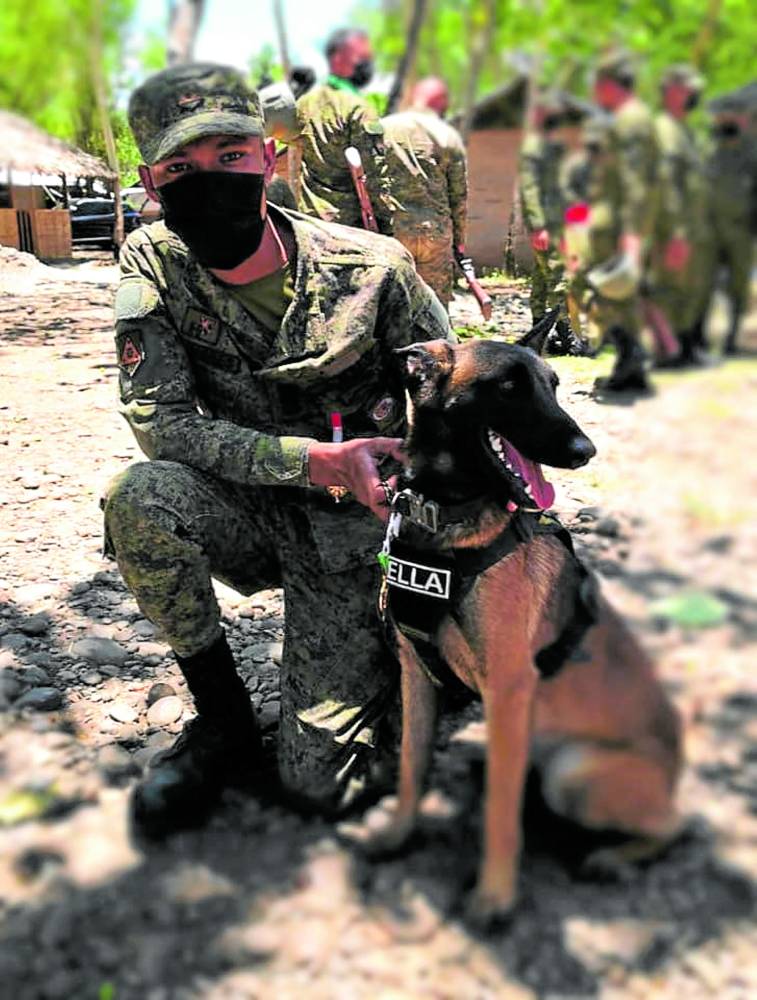 Ella, an Army tracking dog. STORY: Army fetes top dog in anti-red campaign