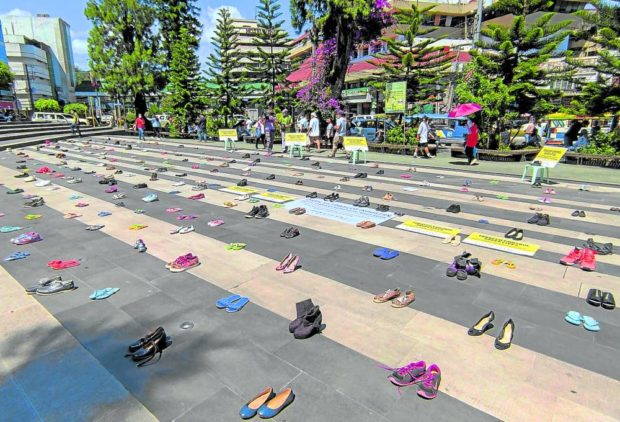 KILLER HABIT Pairs of shoes and other footwear take over Malcolm Square at downtown Baguio City on April 21 to symbolize 321 Filipinos who die each day from tobacco-related diseases. The art installation is put together by medical students and antitobacco advocates in the city. —NEIL CLARK ONGCHANGCO