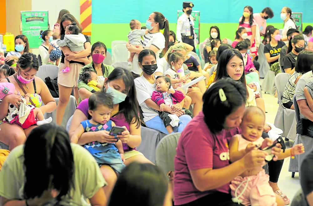 Mothers and babies turn up in droves at SM Masinag in Antipolo City, Rizal, on Thursday, for the “catch-up” immunization drive for infants and toddlers against vaccine-preventable diseases like measles, diphtheria and pertussis, among others. The campaign resumes after being deferred due to the coronavirus pandemic.