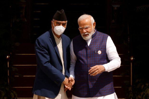 Nepal’s prime minister visits India, meets Modi to deepen ties