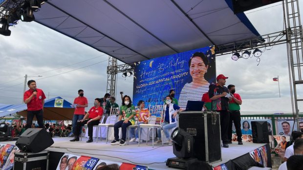 Former President, now reelectionist Pampanga Rep. Gloria Macapagal-Arroyo (center), attends a celebration organized by her supporters in Lubao town, Pampanga province, on the eve of her birthday. (Contributed)