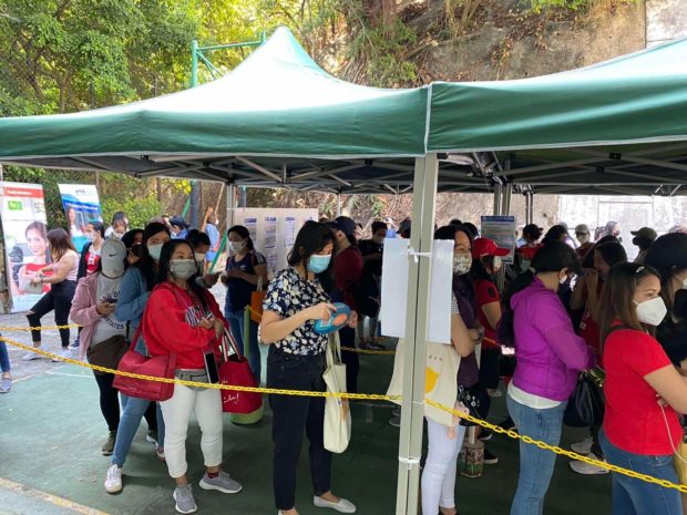 Filipino workers in Hong Kong cue for their turn to cast their vote on the first day of the overseas absentee voting held at the Bayanihan, Kennedy Town Centre, Hongkong. Image from the Consul General Raly Tejada / Facebook