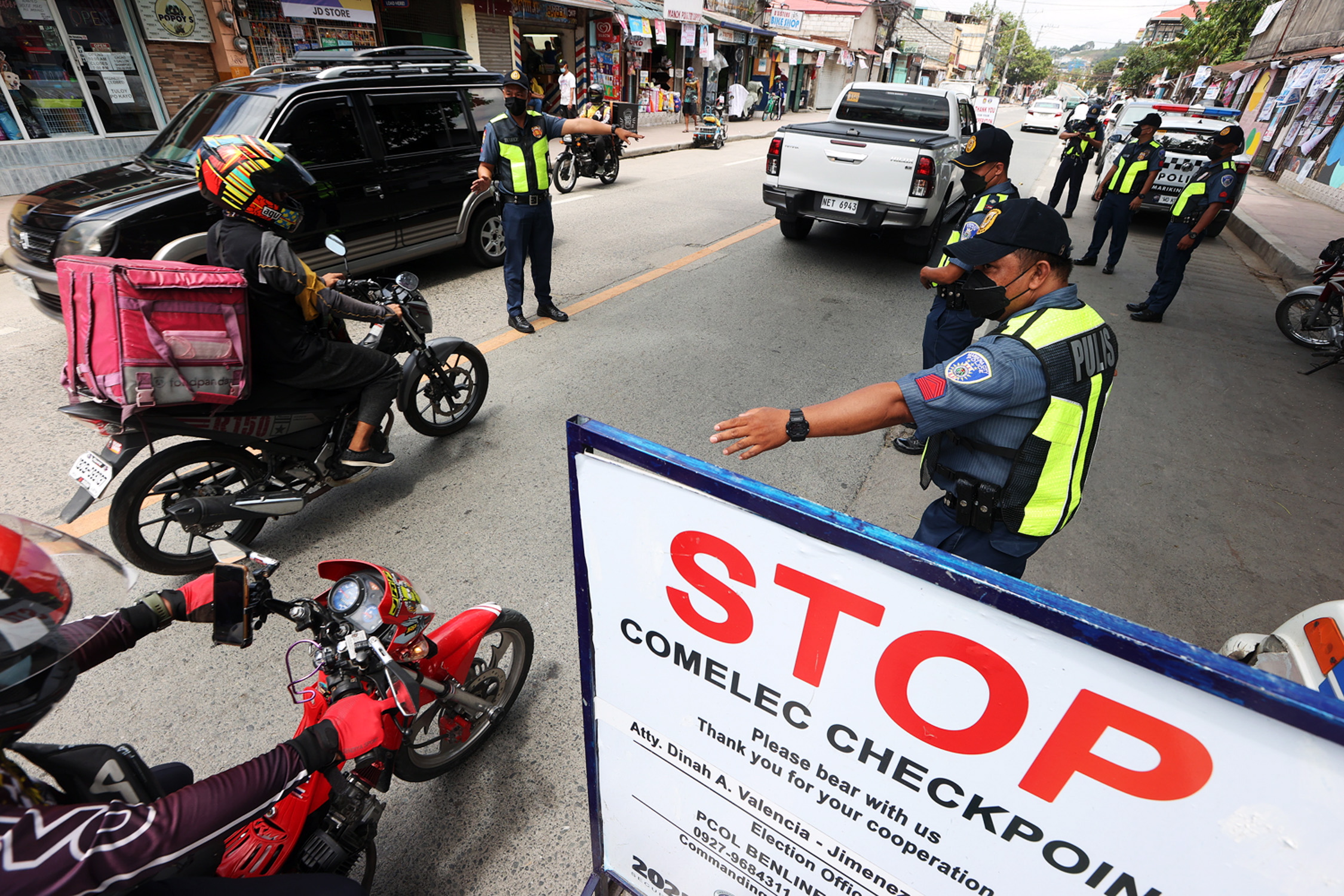 Policemen from Marikina City conduct a checkpoint near Tumana Bridge
